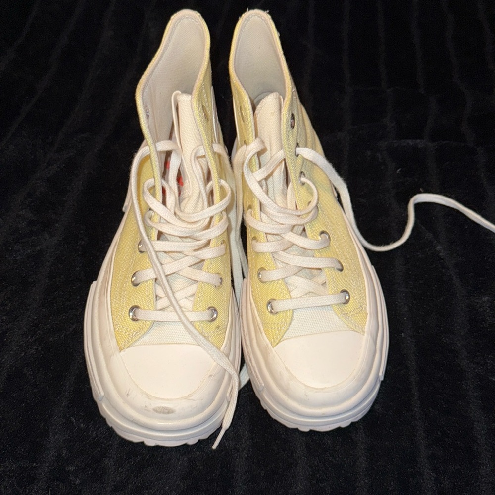 Yellow  high top converse